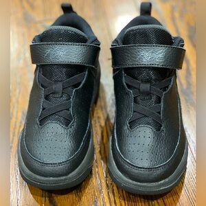 Kids Black Nike sneakers